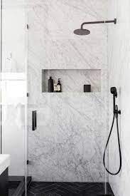 Cottage bathroom features a shower stall boasting chrome and glass on top and cream subway tiles on bottom finished with carrera marble alongside a glass and chrome shower door. Top 50 Best Modern Shower Design Ideas Walk Into Luxury