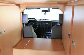 Real jeep styled bed that easily converts from toddler to twin bed plenty of storage under the bed and in the spare tire for bedroom items Kitchen Pull Out Portapotty Bed Set Up The Jeep Actioncamper C Has Been Developed For Overlanding And Expedi Jeep Jeep Wrangler Interior Jeep Wrangler Camping