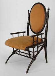 American Victorian Ebonized And Gilt Trimmed Arm Chair With Faux Bamboo Design And Peach Velvet Upholstery