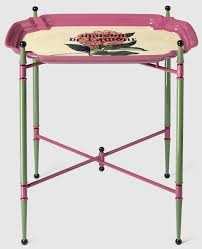 The Metal Folding Table Features A Round Tray Printed With The Words Maison De L Amour A Reference To The Printed Pap Metal Folding Table Folding Table Gucci