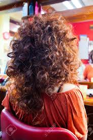Specializing with naturally curly hair in brisbane, sydney & townsville. Woman With Long Curly Hair At Hairdresser Back View Closeup Stock Photo Picture And Royalty Free Image Image 72076569