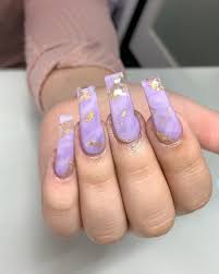 Would you like to learn more about acrylic nails? Lavender Acrylic Nails With Gold Foil Acrylic Nails Purplenails Lavendernails Lilac Nails Purple Acrylic Nails Lavender Nails