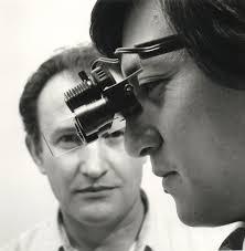 Black and white photograph of Dr Neville Lai Kwon wearing the Topcon model  COMMIDO