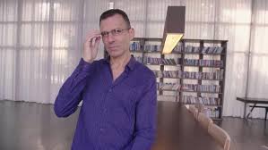 Small business man onsite 60 hours in shop; Portrait Of Professional Businessman Smiling Confident At Camera Enjoying Executive Lifestyle By Stock365