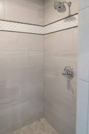 Gray Tiled Shower With Square Tile Shower Floor And White Accent Tile Niche Gray Shower Tile Bathroom Shower Walls Shower Tile