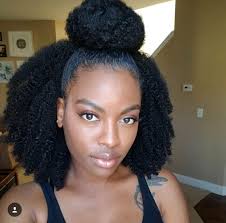While the natural hair movement is gaining popularity, many women of color are just at the start of the journey to their inborn texture. Top Bun Half Down Natural Hair Curly Hair Styles Natural Hair Styles Natural Hair Inspiration