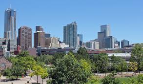 Denver's skyline, framed by the towering peaks of the rocky mountains, shows a vibrant and active outdoor city. Daytime Skyline Of Downtown Denver Colorado Image Free Stock Photo Public Domain Photo Cc0 Images