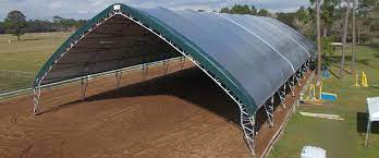 Synthetic sand and rubber surface full set of bsja show. Horse Barns And Riding Arenas Clearspan