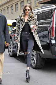 We may earn commission from the links on this page. Gigi Hadid Channels Kate Moss In The Leopard Coat And All Black Outfit Vogue
