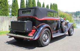 Red with black interior and wearing an older restoration. Cruise In Grandeur With This Restored 1931 Auburn 8 98 Phaeton
