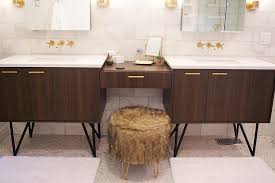 Vanity cabinet is constructed of solid wood and veneers, providing sturdy function and clean appearance. Kohler Jute Walnut Flax Vanity With Brass Hardware Contemporary Bathroom