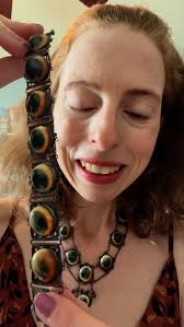 Iris Glass. Iris glass is a term used for a piece of clear glass that has a  mix of pink, blue and green. This is STUNNING IRIS GLASS necklace that has 5