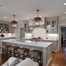 Medium Tone Greige Cabinets Wood Floor White Counters And Back Splash Bronze Light Fixture Kitchen Cabinets Painted Grey Kitchen Inspirations Home Kitchens
