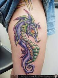 This cute dragon can only bring happiness and positive emotions with it. 50 Nice Looking Dragon Tattoos For Leg
