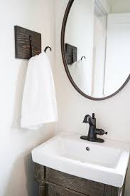 In addition to the bathroom, i also to help organize my kids' bathroom, i removed the towel bar and replaced it with a long wooden board with five hooks: Diy Towel Hooks Life On Beacon