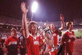 Silver jersey with black collar with a silver line, black shoulders and sleeves with silver stripes and rectangles on the sleeves, black shorts and white socks. Soccer Football Or Whatever Hamburger Sv Greatest All Time Team