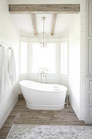 Rustic cabin bathtubs are made out of hollowed out tree trunks. Cottage Bathtub Alcove With Rustic Wood Ceiling Beams Cottage Bathroom