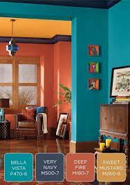 Teal purple and orange living room. Looking For Living Room Palette These Are Our Pick Of The Best Bright And Strong Living Room Colour Sche Blue Living Room Room Color Schemes Living Room Color