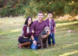 Family Pictures Fall Pictures Pictures With Dog Silver Lab Maroon Fur Vest Boots Fall Family Pictures Family Picture Outfits Fall Family Photos