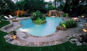 Backyard swimming pool with island. Island Pool With Beach Entry Swimming Pools Backyard Pool Pool Landscaping