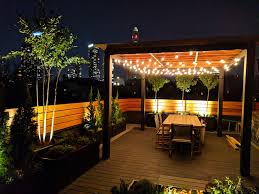 That's a huge bonus on a small lot where space is tight. Nighttime Ambience On Park Slope Roof Garden With Custom Pergola Contemporary Landscape New York By Amber Freda Garden Design Houzz