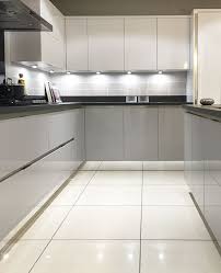 Gloss Mackintosh Kitchen In Light Grey And White With Mirrored Plinth And Inset Light Grey Kitchen Cabinets Light Grey Kitchens Modern Kitchen Cabinets