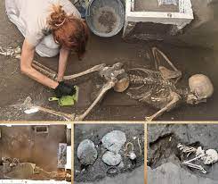 The remains of two more victims of 79 A.D. eruption: a man and a woman with  a small treasure of coins and precious ornaments, have been found in  Pompeii's Regio IX, Insula