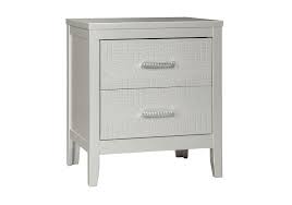 An embroidered decorative pillow and a solid grey bed skirt add chic finishing touches. Olivet Twin Set