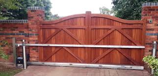 Basically it's chain link fence framing with wood fencing boards. Wooden Sliding Gates