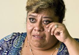 Faces of Immigration: She helps take the dead home