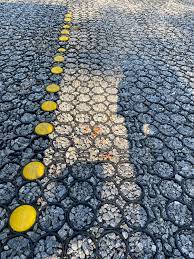 The problem with parking on grass or dirt is the high moisture level. This Parking Lot My Assumption Is The Rubber Grid Keeps The Gravel In Place The Yellow Pieces Mark The Parking Spaces Mildlyinteresting