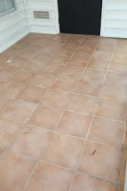 First, i sanded the original tile with an orbital sander to make it rough so it would accept paint better. How To Paint Tile Floor Angela Marie Made