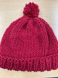 Sts from the two previous rows are knitted from ws: Artsventcalendar Easy Knitted Bobble Hat