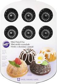 These gorgeously shaped cakes are guaranteed showstoppers whether you serve them mini pans, which are sometimes called bundtlets, are absolutely adorable. Amazon Com Wilton Mini Fluted Tube Pan 12 Cavity Black Muffin Pans Kitchen Dining
