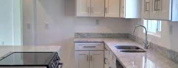 Another con about white carrara marble is it being a very porous stone that will absorb stains and etch. White Shaker Kitchen Cabinets With Carrara Marble Countertops