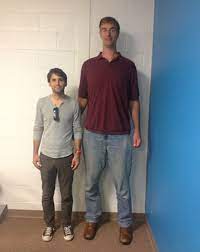 What It S Like To Live As A Seven Foot Seven Giant Tall Guys Tall People Giant People