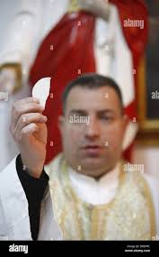 Holding the mass hi-res stock photography and images