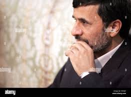 Malaysian Prime Minister Abdullah Ahmad Badawi, left, speaks with Japanese  Prime Minister Shinzo Abe during a banquet of a symposium