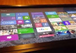 A surface machine is about the size and shape of a coffee table with a flat. Windows 8 Running On Original Microsoft 40 Inch Surface Coffee Table Video