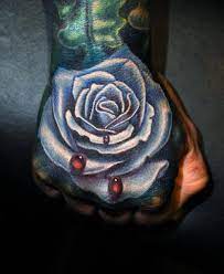 Nikko Hurtado Awesome Blue Rose Hand Tattoo Tattoo Tattoed Tattooedgirls Customtattoo Tattoos Art Realistic Rose Tattoo Hand Tattoos Rose Tattoos