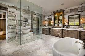 The master bathroom is kind of a funky space, with a lot of angles and walls, so we kept everything very simple and bright white, with very few frills. The Modern Dual Primary Bedroom Trend In Luxury Homes