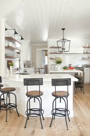 Though this kitchen is more modern with stainless steel appliances and finishes, the wood cabinets add a bit of farmhouse charm to the space. Modern Farmhouse Kitchens For Gorgeous Fixer Upper Style