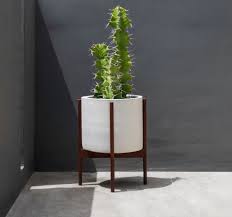 The shipping is a little rough, but it's still less and good luck finding a cylindrical pot that will fit in the handmade plant stand that doesn't total more than the original case study planter! Case Study Ceramics Large Cylinder Planter With Wood Stand By Modernica At Calgary S Kit Interior Objects