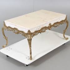 Raised on four square ebonized fruitwood feet below an elegant bottom tier with an arbalest sh. Coffee Table Marble Brass Louis Xvi Style 1900s Furniture Tables Auctionet