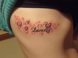 Baby Name Design With Hearts On Ribs For Female Cute Tattoo Designs Boyfriend Name Tattoos Tattoos With Kids Names Tattoo Designs For Women