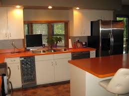 orange countertop with white cabinets