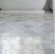 In this opulent bathroom, marble subway tiles climb to the ceiling and are accented with a thick border tile. Marble Tiles Rms Traders Affordable Bathroom Tiles