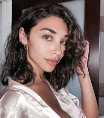 Young girl with brown hair and tanned skin looking straight in to the camera. Curly Brown Hair Images On Favim Com