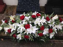 It is designed with red gerbera, white avalanche roses, white freesia and. Deep Red Roses And White Lily Funeral Coffin Spray Funeral Flower Spray Funeral Spray Tribute Www Funeral Flower Arrangements Casket Flowers Funeral Flowers