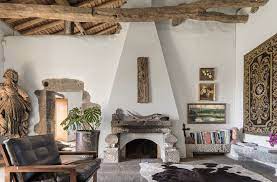 How A Portuguese Family Manor Is Transformed Into A Heritage Rich Island Getaway Stylish Living Room Modern Fireplace Natural Stone Fireplaces